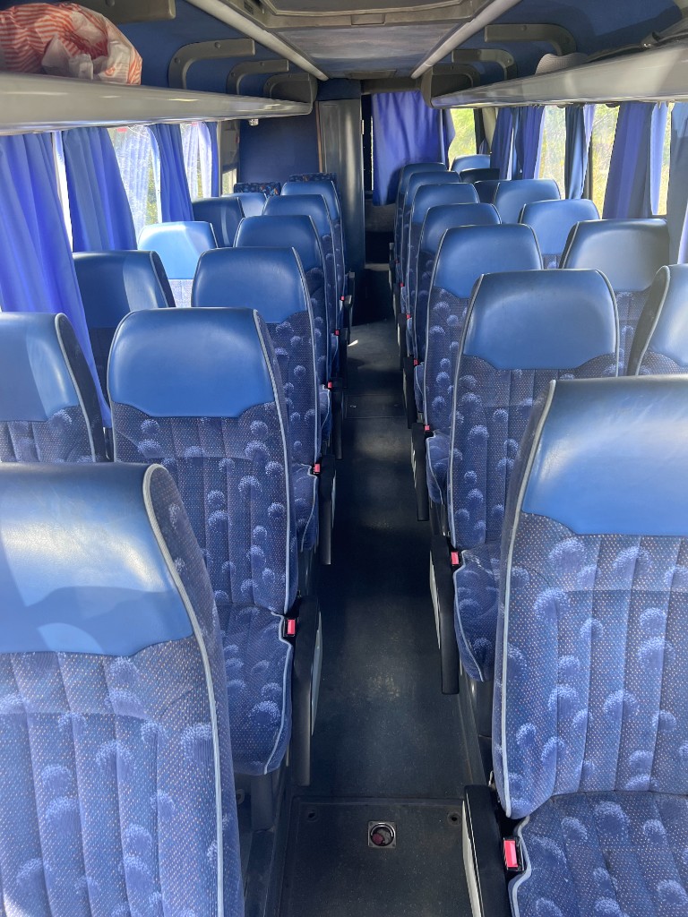 Comfortable bus interior for group travel Ikaria